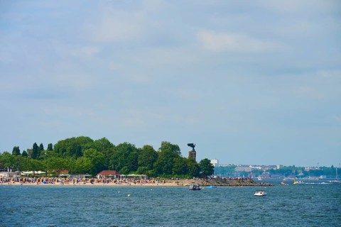 Beach with trees and many visitors by the sea, Heikendorf, Plön district, Kiel Fjord,