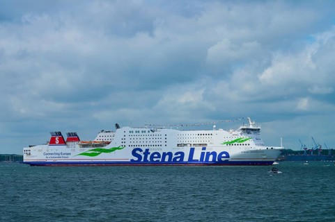 Stena Line ferry sails calmly across the sea under a dramatic, cloudy sky, Windjammer Parade Kiel