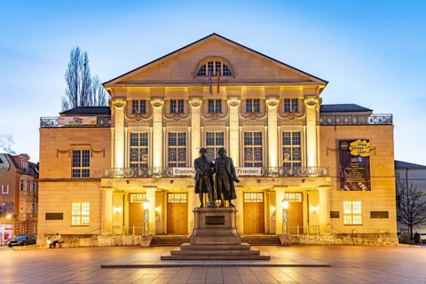 The German National Theatre with the Goethe and Schiller Monument at dusk, Weimar, Thuringia,