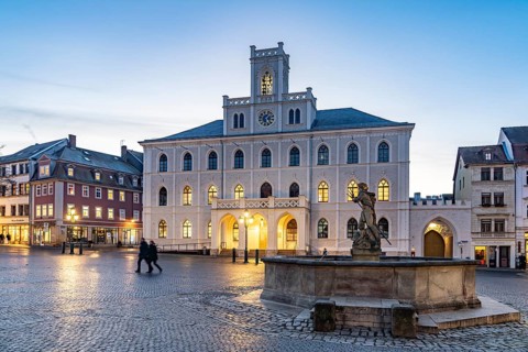 The town hall and Neptune fountain on the market square at dusk, Weimar, Thuringia, Germany
