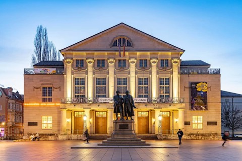 The German National Theatre with the Goethe and Schiller Monument at dusk, Weimar, Thuringia,