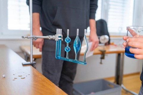 Measuring device with blue liquid in a laboratory for experimental purposes, Youth Research Centre