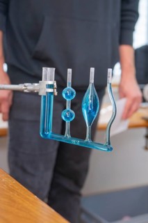 Blue-filled glass tubes in a laboratory for a scientific experiment, Youth Research Centre