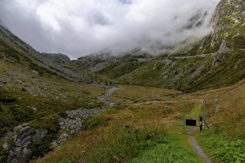 Fog, hiking trail at the Gotthard Pass, right pass road, Hospental, Uri, Switzerland