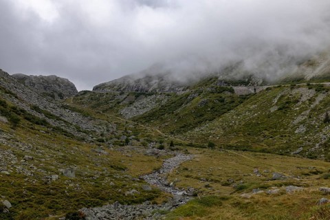 Fog, hiking trail at the Gotthard Pass, right pass road, Hospental, Uri, Switzerland