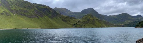 Lago Ritom panorama, right Passo del Sole and Passo dell'Uomo, left road on the lakeshore, Airolo,
