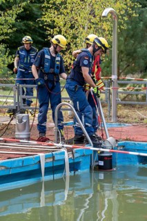 Emergency services practise the use of pumps that are used, for example, during floods, at an old
