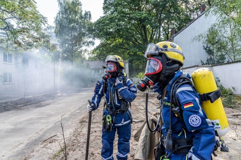 Civil defence exercise scenario, after a drone attack on a residential area, emergency services