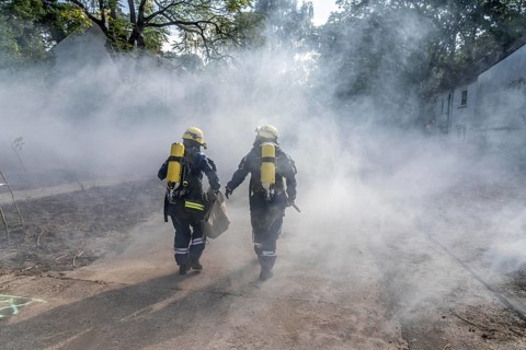 Civil defence exercise scenario, after a drone attack on a residential area, emergency services