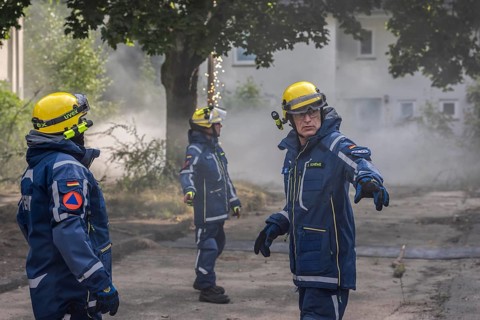 Civil defence exercise scenario, after a drone attack on a residential area, emergency services