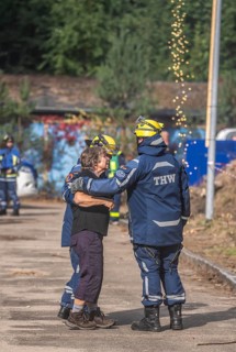 Civil defence exercise scenario, after a drone attack on a residential area, emergency services
