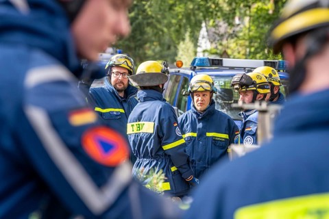 Civil defence exercise scenario, after a drone attack on a residential area, emergency services
