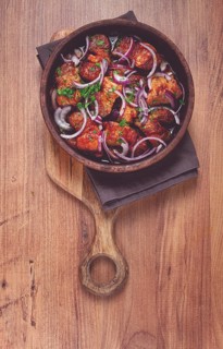 Fried meat, pork kebab, ketsi in a clay pan, with red onions and herbs, homemade, no people