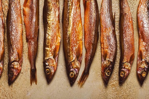 Cold smoked capelin, on the table, top view, no people