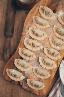 Gyoza cooking, on a cutting board, gyoza Japanese dumplings, top view, selective processing, raw