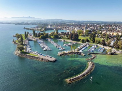 Harbour area, ferry port, yacht harbour, marina of the town of Romanshorn with Seepark, on the left