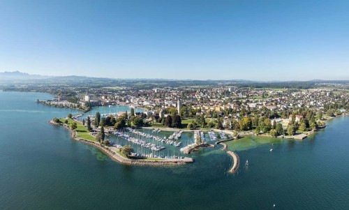 Harbour area, ferry port, yacht harbour, marina of the town of Romanshorn with Seepark, far left