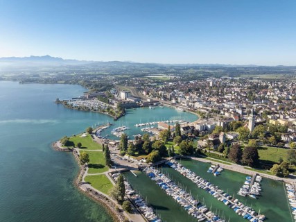Harbour area, ferry port, yacht harbour, marina of the town of Romanshorn with Seepark, on the left