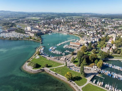Harbour area, ferry port, yacht harbour, marina of the city of Romanshorn with Seepark, aerial