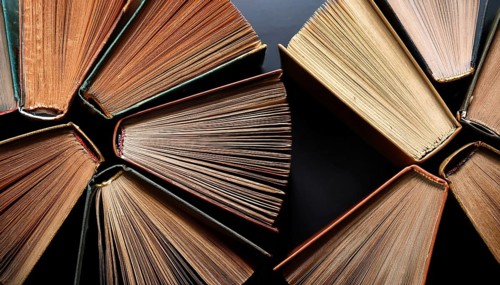 Old books arranged highlighting their historical significance. Neatly arranged representing a