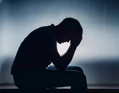 Silhouette of Sad Depressed man sitting. embodying deep despair and hopelessness, AI generated