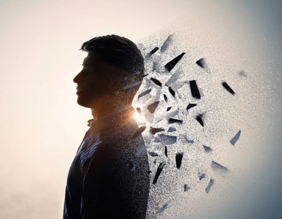 Creative image showing a silhouette of a man merging with an abstract dispersion effect and