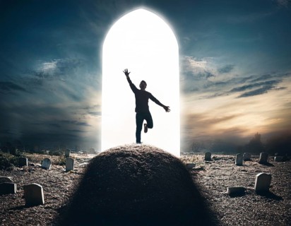 A silhouette of a lone figure walking off a gravestone, The scene evokes Resurrection thoughts