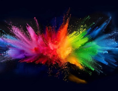 Colorful abstract art depicting a vibrant explosion of rainbow hues on a dark background, evoking