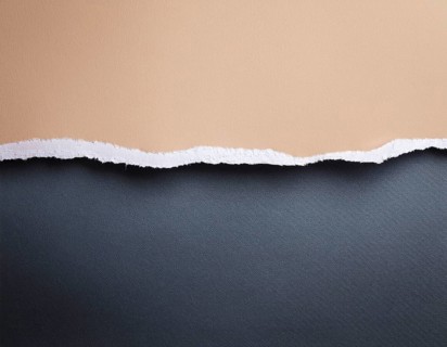 Torn paper reveals a surface underneath, symbolizing mystery and space, AI generated