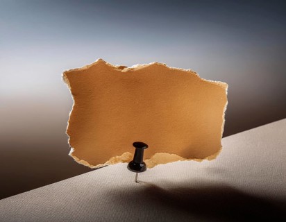 Torn paper reveals a surface underneath, symbolizing mystery and space, AI generated