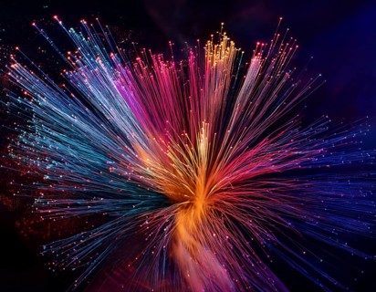 Glowing fiber-optic lights in vivid colors, creating a futuristic and dynamic visual effect, ideal
