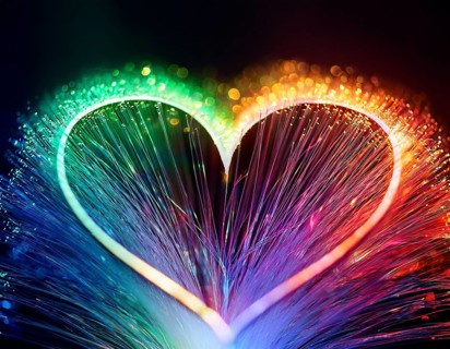 Colorful artistic display featuring vibrant light patterns shaped like a heart, expressing love and