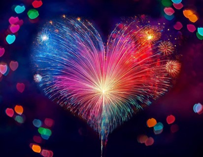 Colorful artistic display featuring vibrant light patterns shaped like a heart, expressing love and