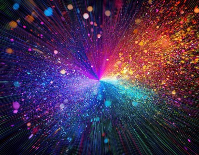Vibrant and energetic multicolored powder explosion captured against a dark background. Evoking