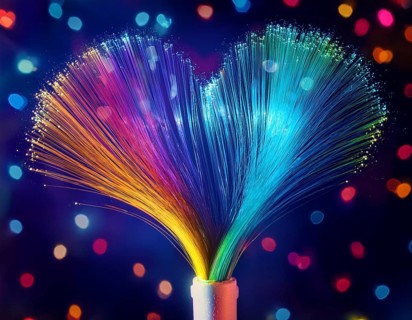 Colorful artistic display featuring vibrant light patterns shaped like a heart, expressing love and