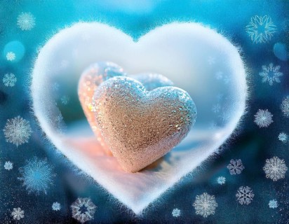 A frosted heart-shaped opening on a window with glowing bokeh lights and snowy patterns, evoking
