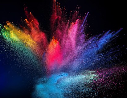 A colorful explosion powder on black background.. Multicolored powder explosion, AI generated