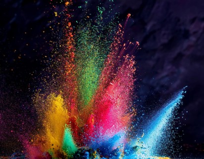 A colorful explosion powder on black background.. Multicolored powder explosion, AI generated