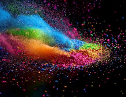 A colorful explosion powder on black background.. Multicolored powder explosion, AI generated