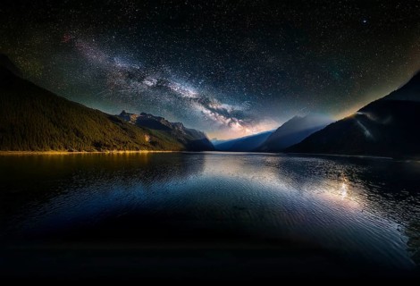 Rustic wooden platform set against a breathtaking backdrop of a star-filled night sky, featuring