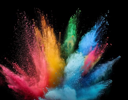 A colorful explosion powder on black background.. Multicolored powder explosion, AI generated