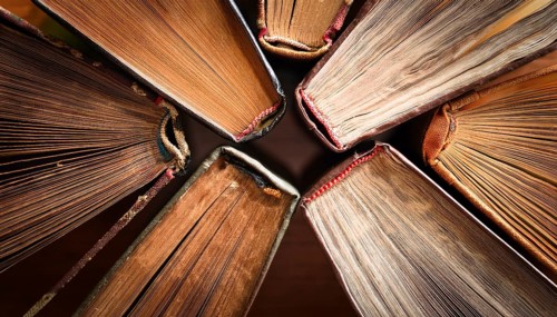 Old books arranged highlighting their historical significance. Neatly arranged representing a