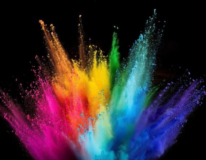 A colorful explosion powder on black background.. Multicolored powder explosion, AI generated