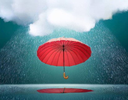 A vibrant red umbrella shielding against rain under an overcast sky, evoking protection, serenity,
