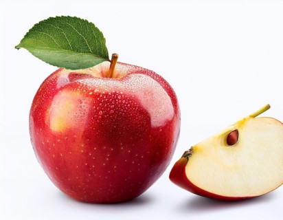 Close-up of a vibrant red apple with a green leaf and a sliced half, showcasing its glossy texture