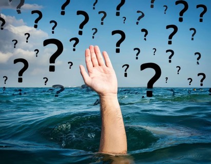 An extended hand emerges from water surrounded by floating question marks, artistically