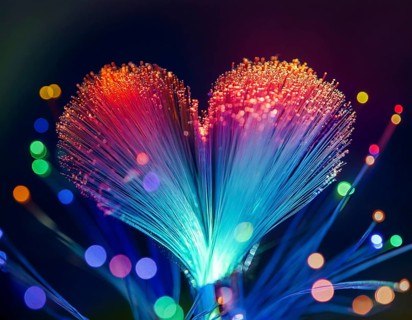 Colorful artistic display featuring vibrant light patterns shaped like a heart, expressing love and