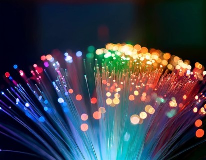 Glowing fiber-optic lights in vivid colors, creating a futuristic and dynamic visual effect, ideal