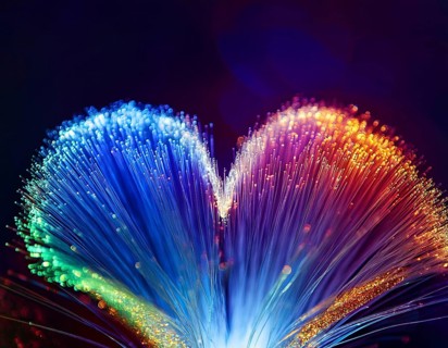 Colorful artistic display featuring vibrant light patterns shaped like a heart, expressing love and
