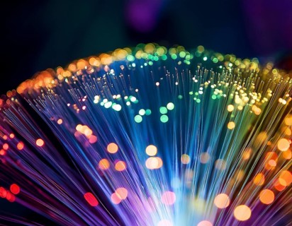 Glowing fiber-optic lights in vivid colors, creating a futuristic and dynamic visual effect, ideal